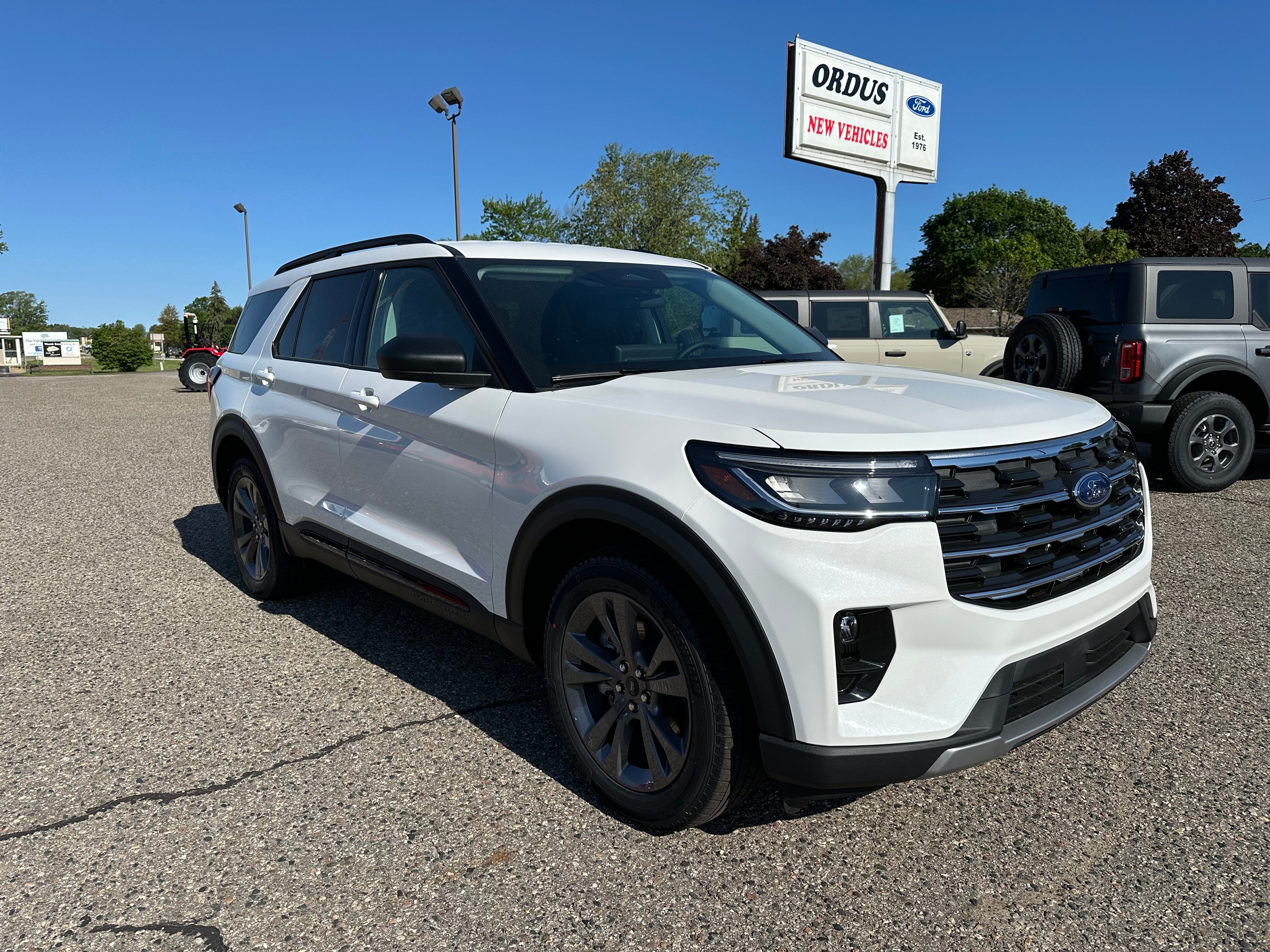 2026 Ford Explorer Active in Star White Metallic Tri-Coat — front three-quarter view