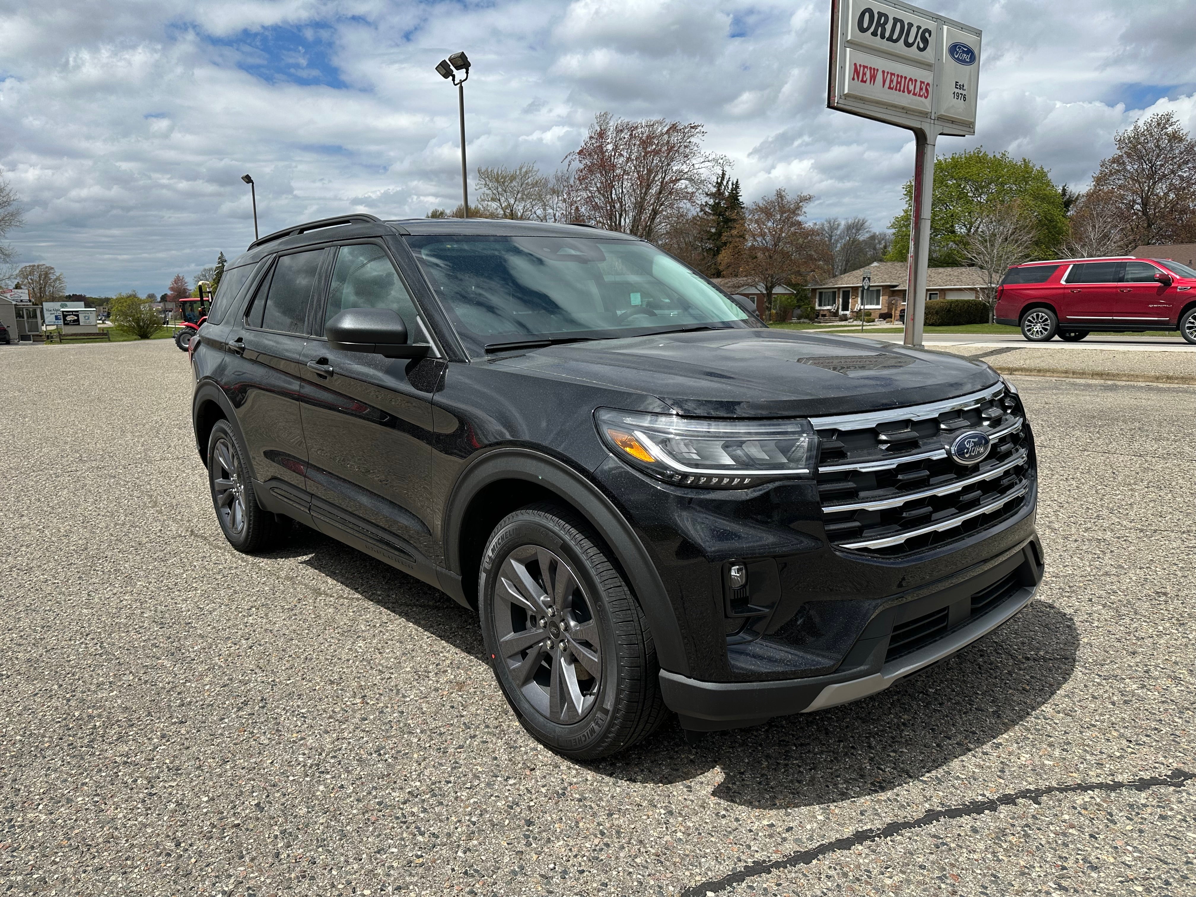 2026 Ford Explorer Active in Agate Black Metallic — front three-quarter view