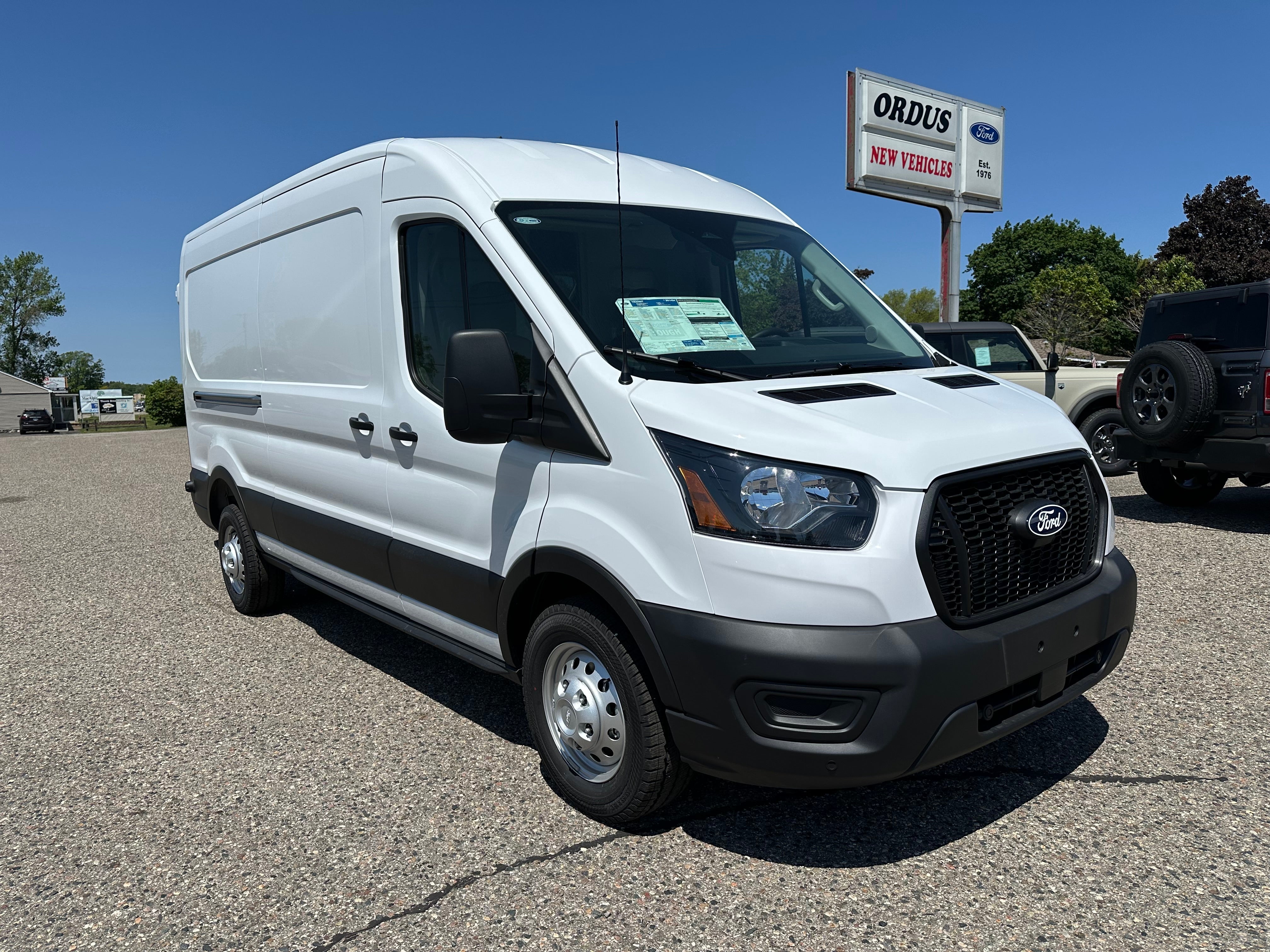 2026 Ford Transit Commercial Cargo Van in Oxford White — front three-quarter view