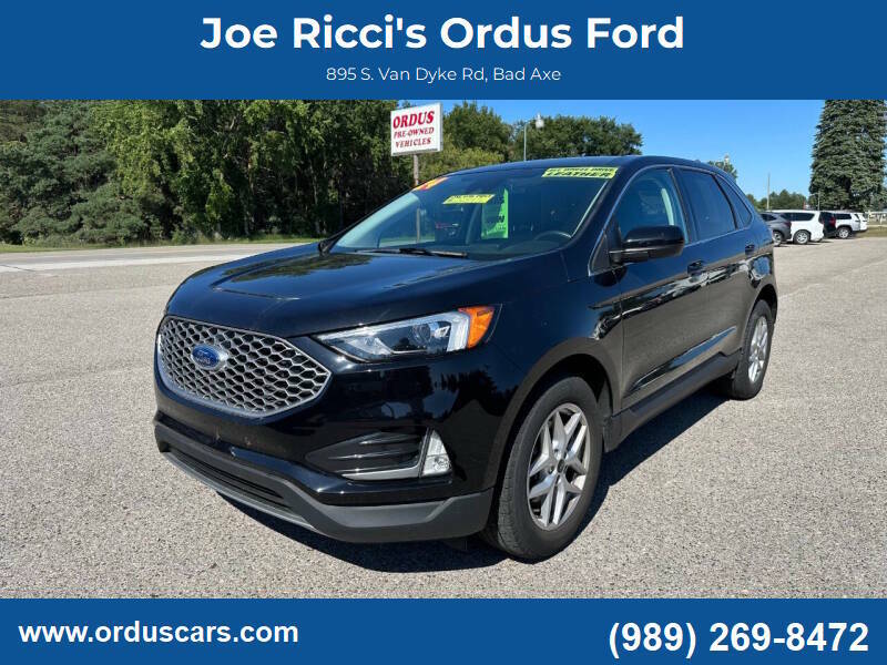 2024 Ford Edge SEL AWD 4dr SUV in Black — front three-quarter view