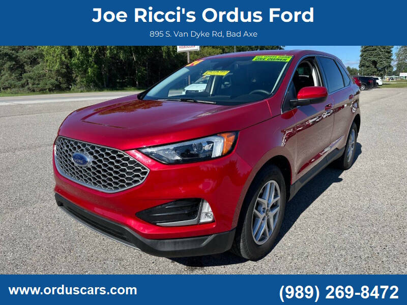 2024 Ford Edge SEL AWD 4dr SUV in Rapid Red — front three-quarter view